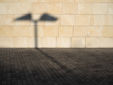 A background with a shadow of street light on the wall