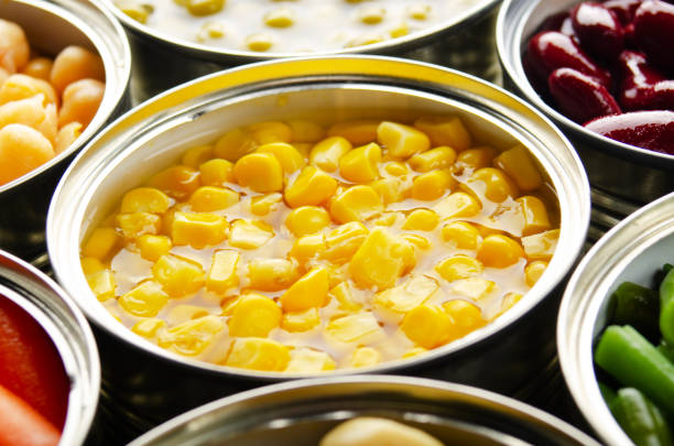 istock Canned sweet corn in just opened tin can. Non-perishable food 1225416797