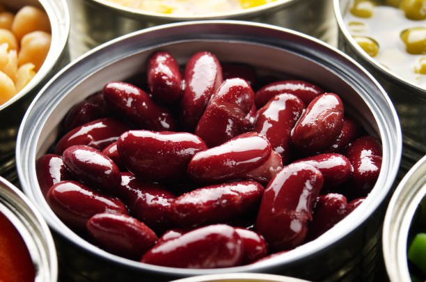 istock Canned red kidney beans in just opened tin can. Non-perishable food 1225417494
