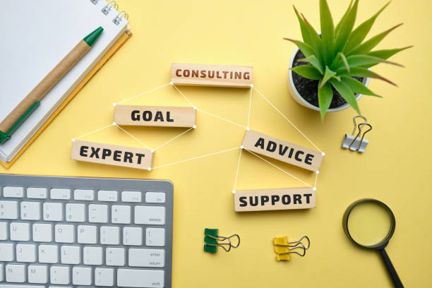 istock Consulting concept - wooden blocks with inscriptions goal, expert, advise, support. 1225417895