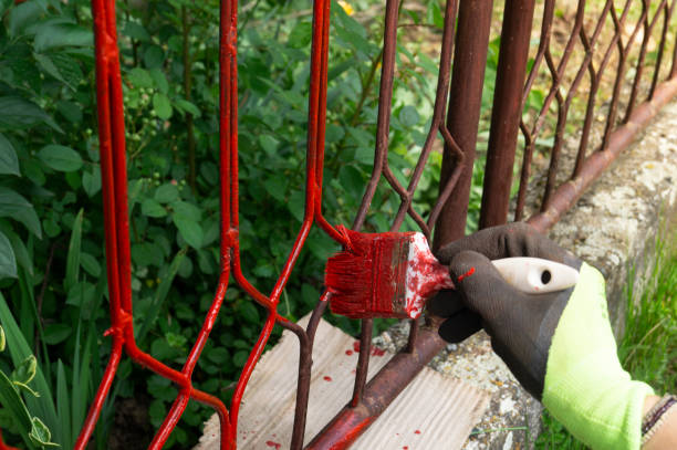 istock Hand with brush that painting metal railing construction 1225418664