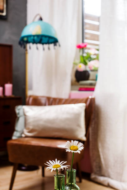 istock Cozy place with flowers and candles 1225420090