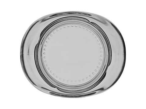 Empty glass jar of oval shape, top view. Isolated on a white background