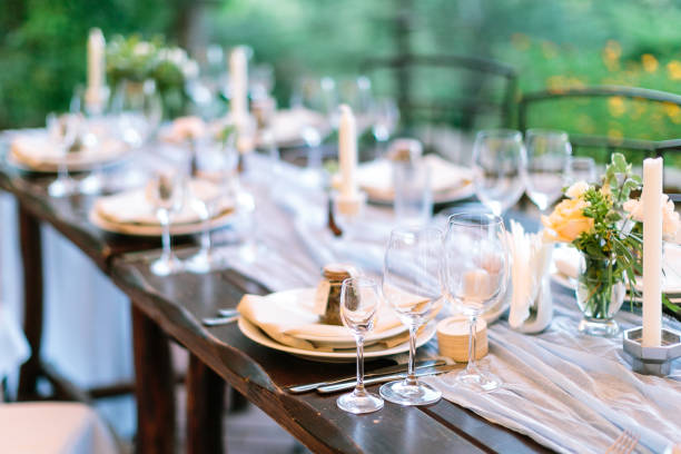 istock Range of served venues for a festive open-air welcome dinner at the wedding with personalized gifts for guests at each of them 1225423375
