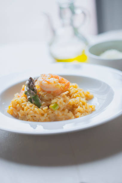 istock Risotto with asparagus and shrimps in plate 1225424071