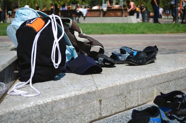 Go abroad to relax, there are a lot of bags on a Park bench