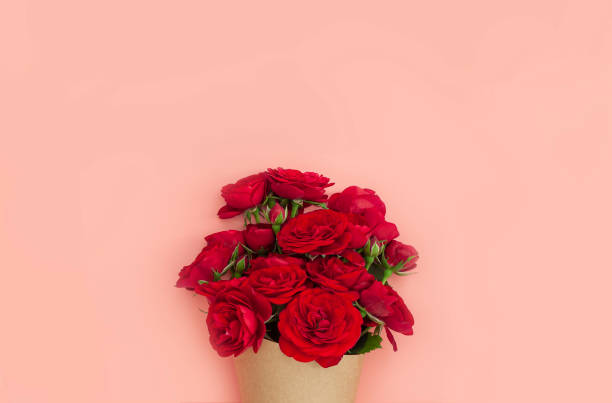 istock Red rose bouquet wrapped vintage craft paper. 1225425498