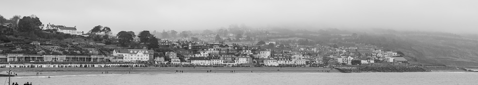 Panoramic photo of Lyme Regis in Dorset on a cloudy day