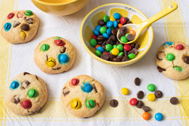 istock Multi-colored chocolate candy dragees and Chocolate Chips Homemade Cookies 1225428394