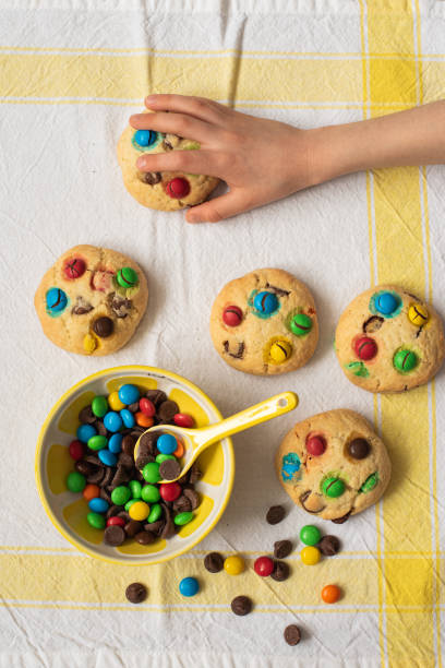 istock Multi-colored chocolate candy dragees and Chocolate Chips Homemade Cookies 1225428477