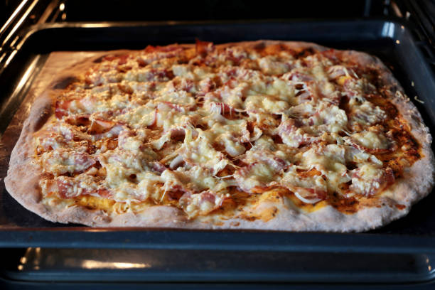 istock Cooking pizza, freshly baked pie in electric oven 1225429785