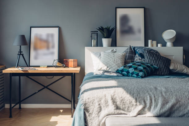 istock Bedroom. Home interior, apartment. Table and bed with pillows. 1225431112