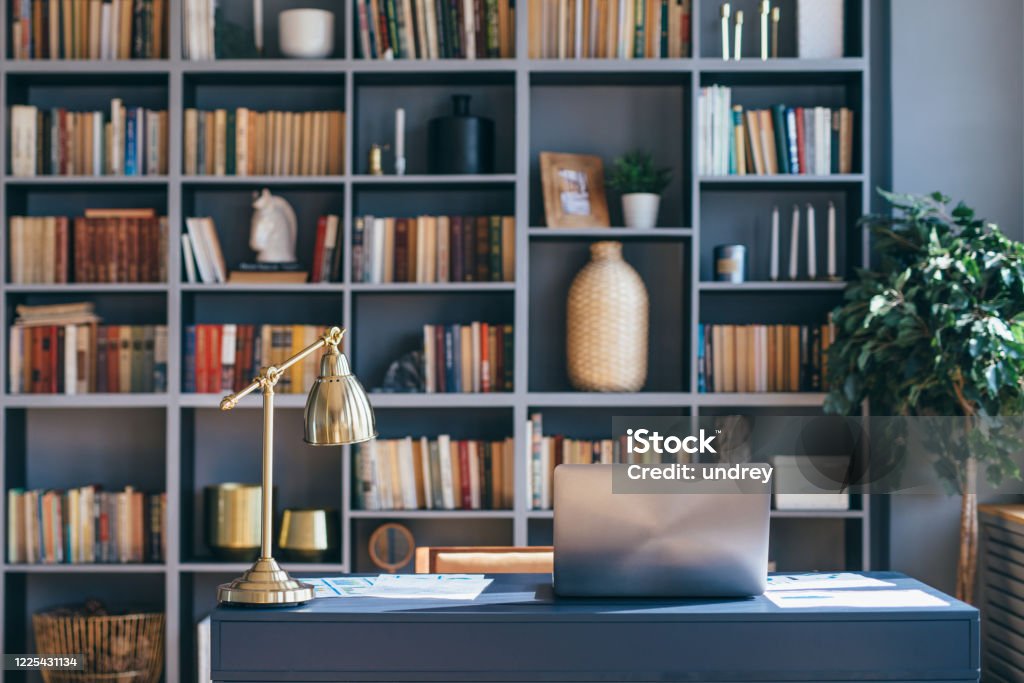 Table with laptop in home office interior. Table with laptop in home office interior Home Office Stock Photo