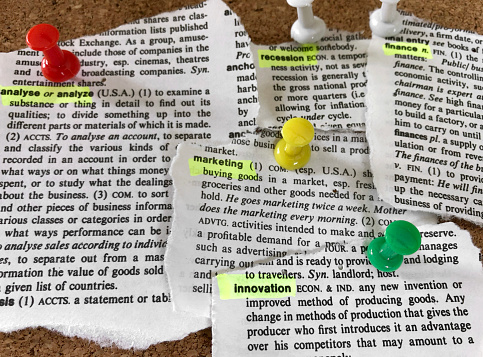 Dictionary piece pinned to the cork board.