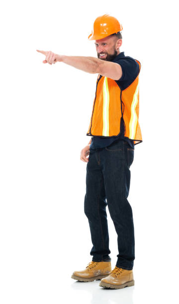 istock Construction worker standing wearing pants and holding hammer 1225432468