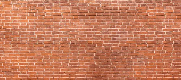 Photo of Abstract red brick wall panoramic background