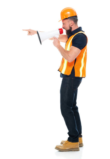 istock Technician repairing wearing button down shirt and holding megaphone 1225432614