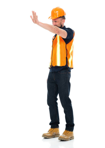 istock Working class standing wearing waistcoat and holding hammer 1225433318
