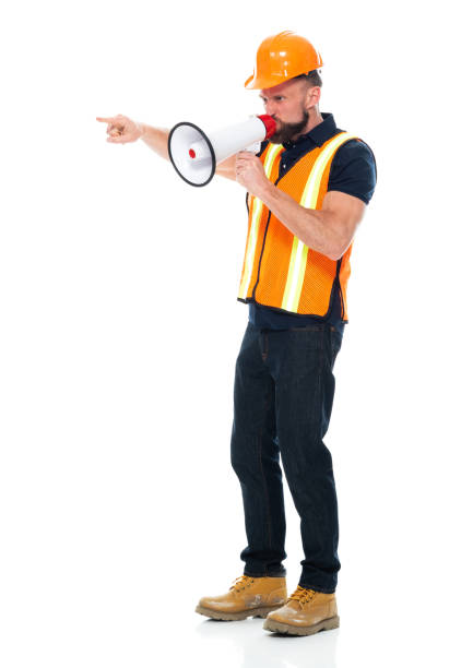 istock Repairman standing wearing pants and holding megaphone 1225433320