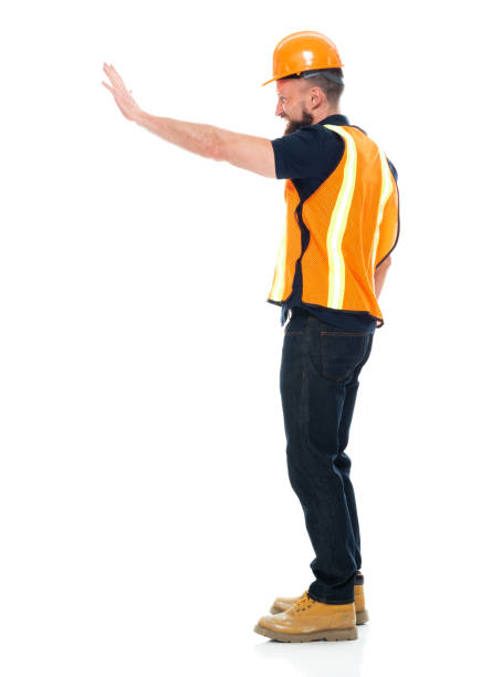 istock Manual worker repairing wearing protective workwear and holding hammer 1225433345