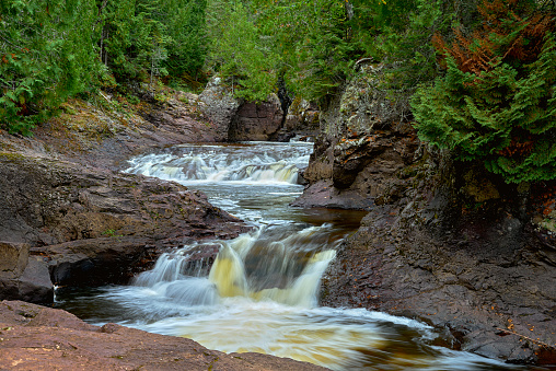 one of a number of falls along the cascade river, flowing down towards lake superior, cascade river state park, minnesota.