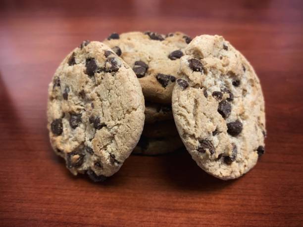 a stack of chocolate chip cookies - close up cookie gourmet food imagens e fotografias de stock