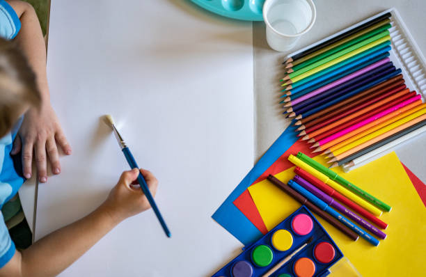 istock Boy is start to paint with watercolor 1225433902