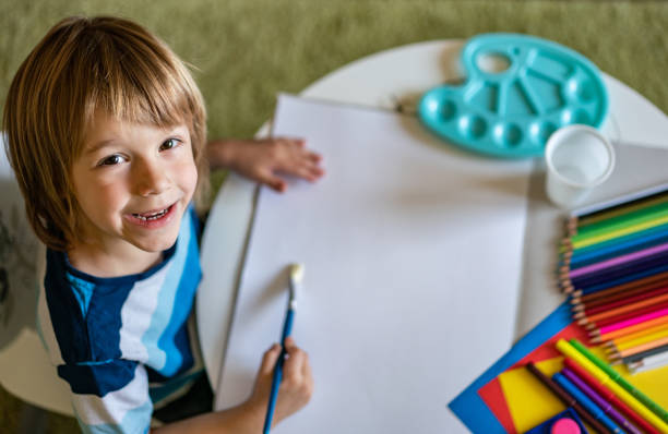 istock Little boy with art products 1225434129