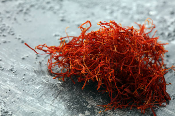 istock Kesar, Saffron, Crocus Sativus on rustic table, Pile of indian Saffron 1225436567