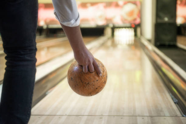 istock Rear shot of an unrecognizable young man throwing bowling ball 1225436703
