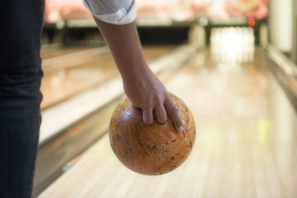 istock Rear shot of an unrecognizable young man throwing bowling ball 1225436763