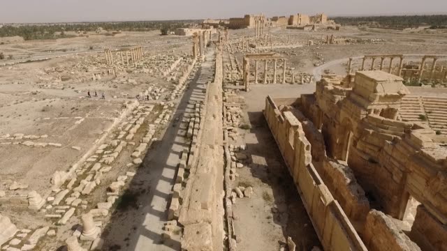 Amphitheater's ruins of Palmyra in Syria. The ancient building is destroyed after the syrian civil war - aerial view with a drone