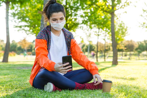 istock Woman with cell phone in hand - coronavirus 1225436959