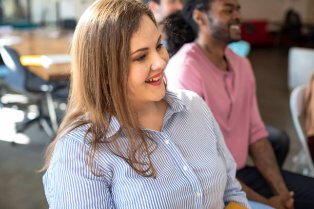 istock A Woman in Audience Smiling 1225439253