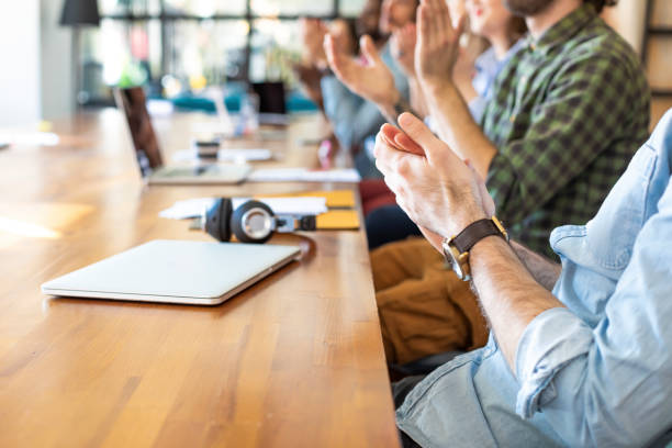 istock Praise and Support: a Group of Modern Businesspeople Clapping their Hands 1225439260
