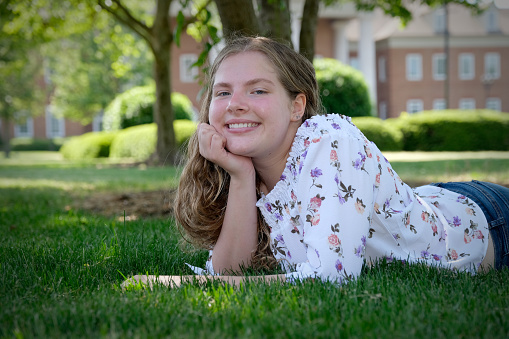 Teenage girl portrait with copy space having a relaxing time outdoors.