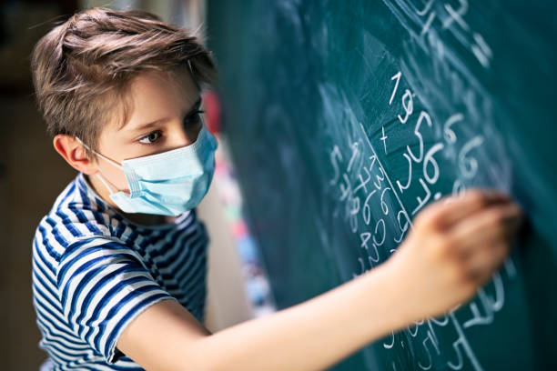 Cute little boy on math lesson during COVID-19 pandemic Little boy wearing face mask doing math calculations.
Nikon D850 reopening photos stock pictures, royalty-free photos & images