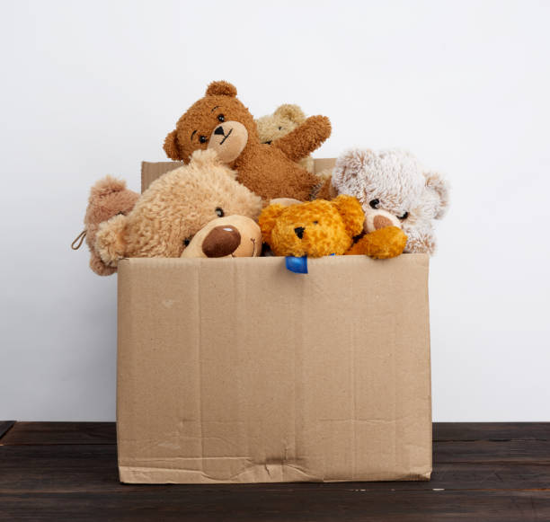 istock brown cardboard box filled with soft toys 1225450236