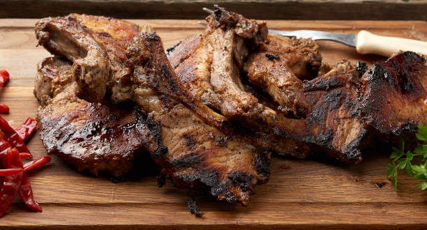 istock grilled pork steaks on the bone on a kitchen cutting board 1225450286