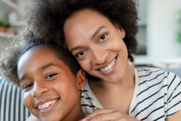 istock Safe in her Mom's embrace 1225450459