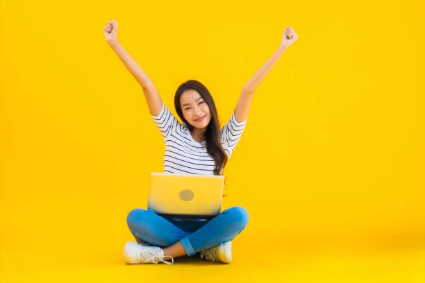 istock Portrait beautiful young asian woman use laptop or notebook 1225451580