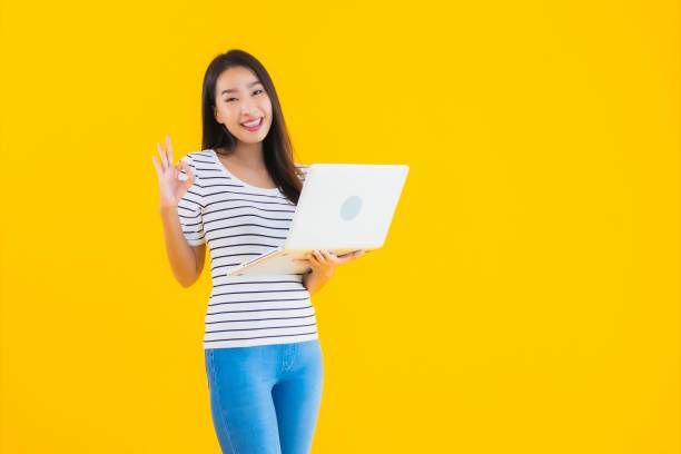 istock Portrait beautiful young asian woman use laptop or notebook 1225456183