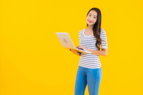 istock Portrait beautiful young asian woman use laptop or notebook 1225456210