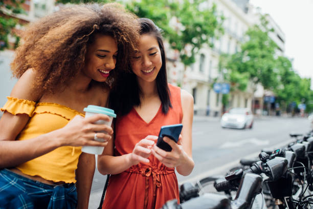 istock Girls taking rent-a-bikes after shopping 1225457918