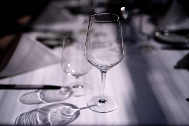 istock The table is covered with a white tablecloth, there are products, the light beautifully falls through the glass, photo is bright, 1225457992