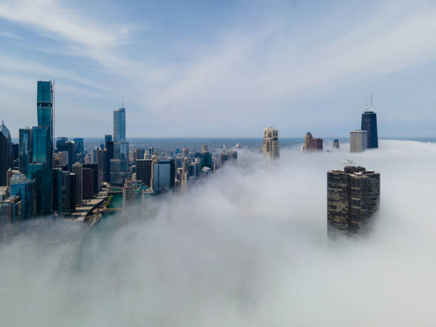 chicago cityscape in fog gewickelt - luftbild - chicago illinois lake hancock building stock-fotos und bilder