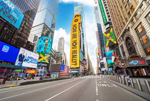 Manhattan, New York, USA - May 16, 2020:  New York City Times Square on lockdown and social distancing was put in place to prevent the spread of Covid-19, the coronavirus pandemic