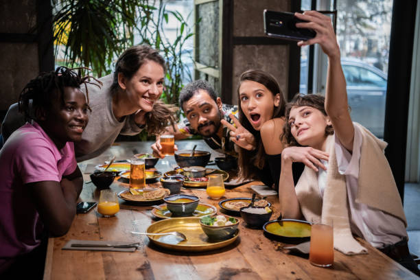 istock Group of young students making funny faces, taking selfies with 1225465023