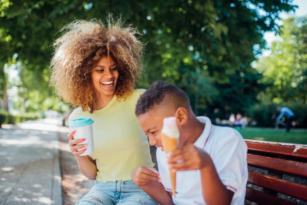 istock Afro woman and her boy having fun at the park 1225469478