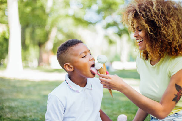 istock Boy trying his mom's ice cream and having fun 1225469494